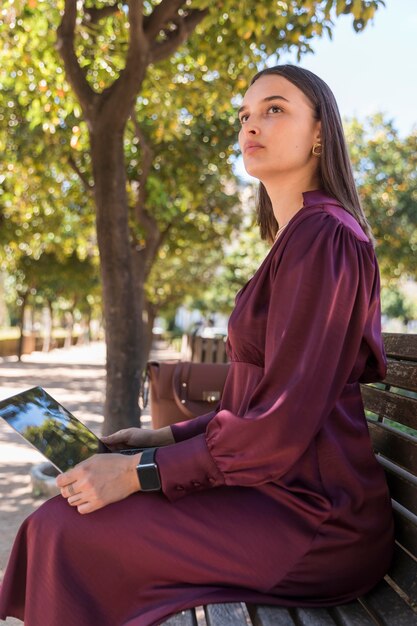 Side view woman working on bench