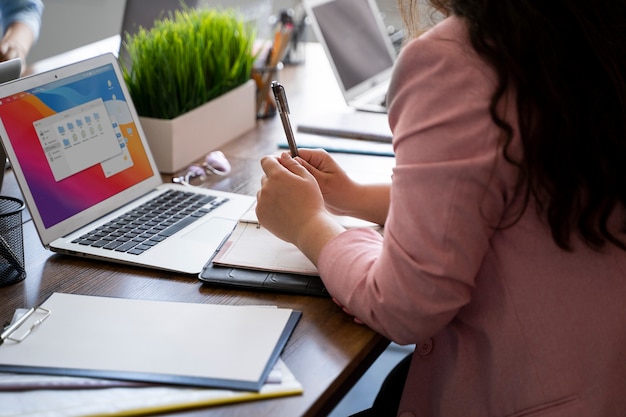 Side view woman working at desk