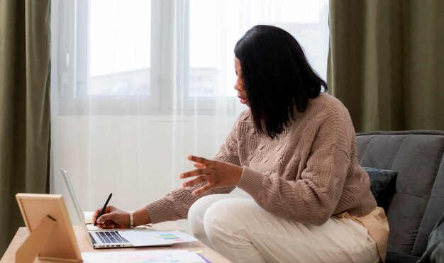 Side view woman working from home