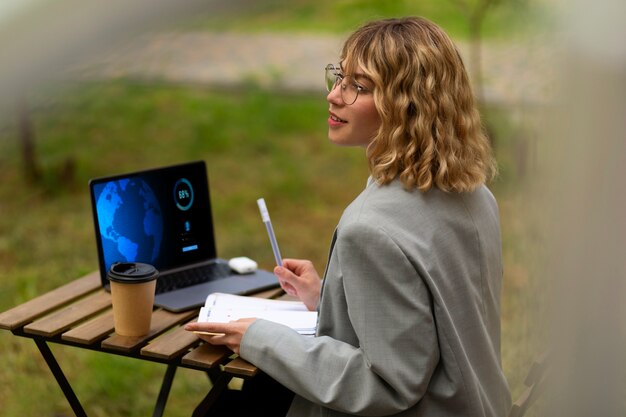 Side view woman working outdoors