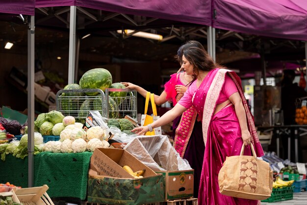 Side view women shopping for groceries