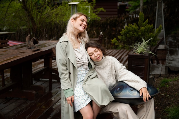 Side view women with handpan outdoors