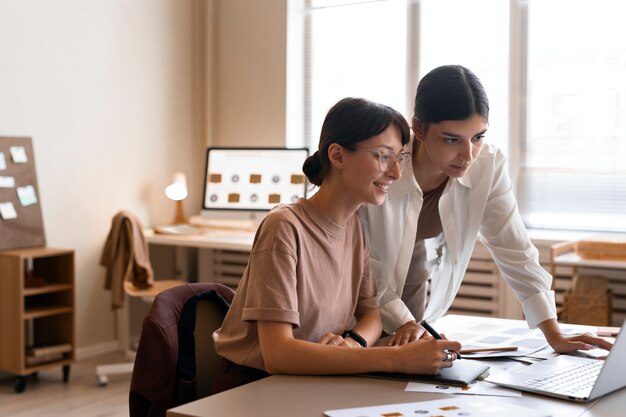 Side view women working together