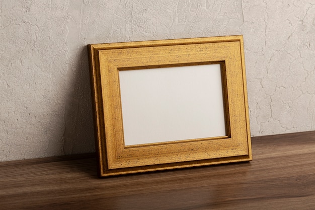 Free photo side view wooden empty frame