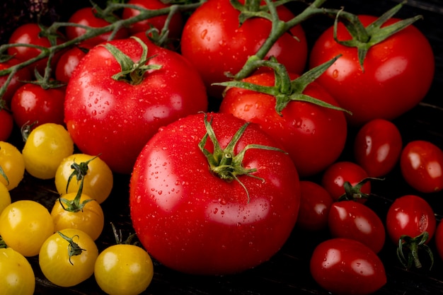 Side view of yellow and red tomatoes