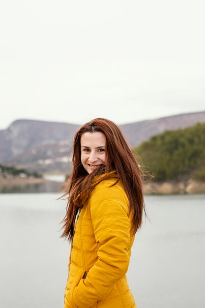 Side view young beautiful woman in nature