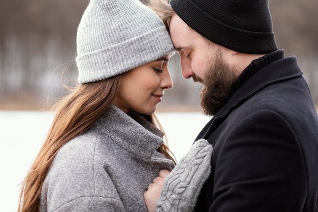 Side view young couple hugging