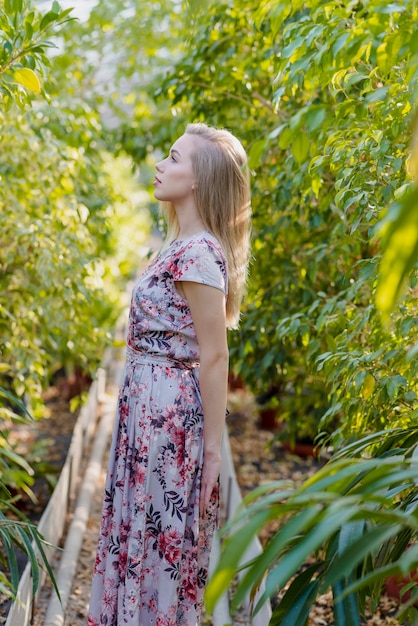 Side view young female posing in foliage center