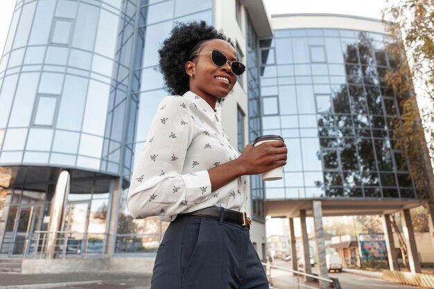 Side view young female with coffee outdoor