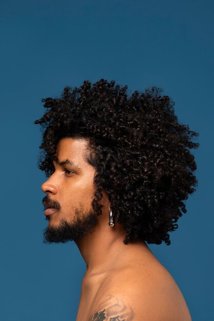 Side view young man posing in studio