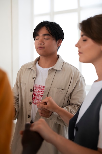 side-view-young-people-church-praying_23