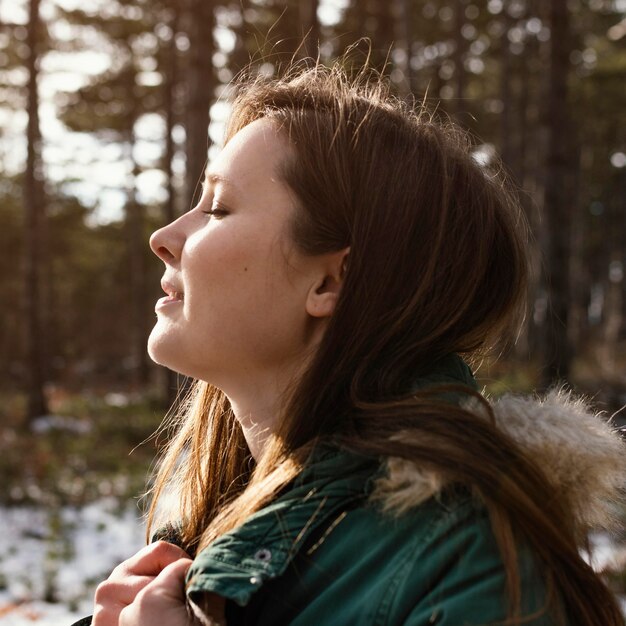 Side view young woman in nature