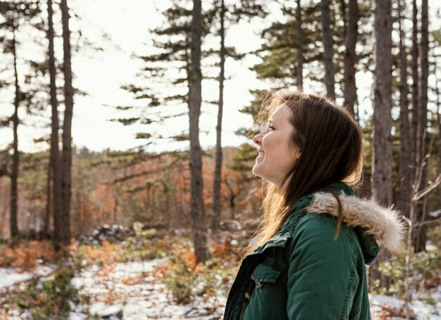 Side view young woman in nature