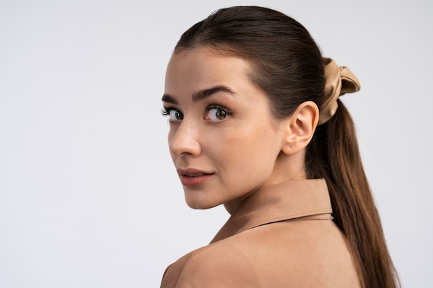 Side view young woman posing in studio