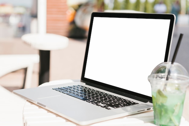 Sideview of laptop and lemonade mockup