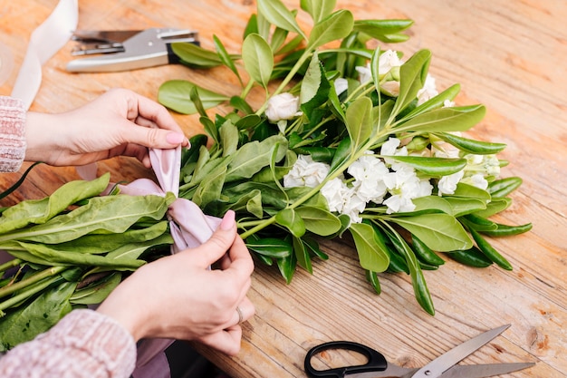 Sideways bunch of flowers with a bow