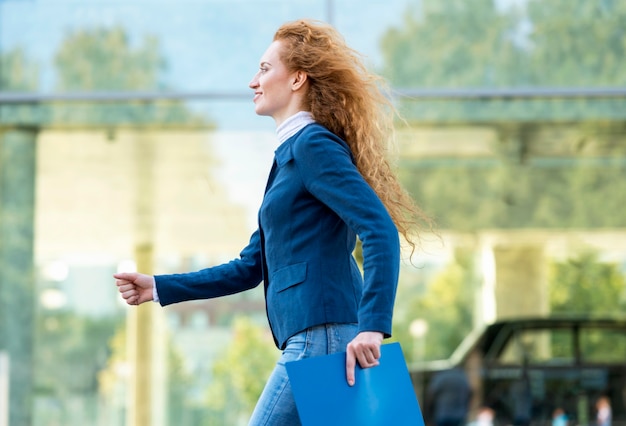 Sideways businesswoman walking confident