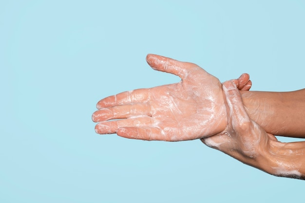 Sideways hands washing with soap