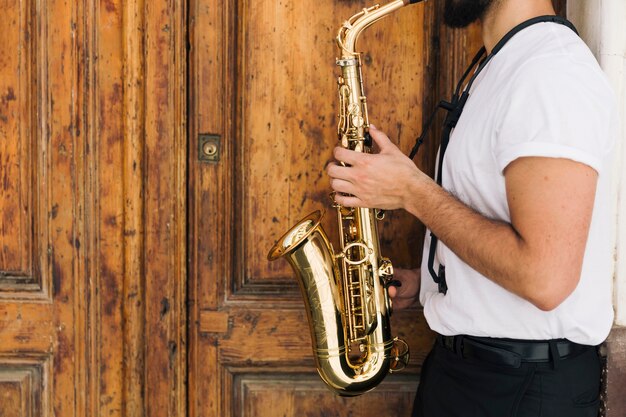 Sideways musician playing the saxophone