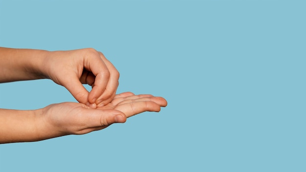 Free photo sideways person washing hands with copy space