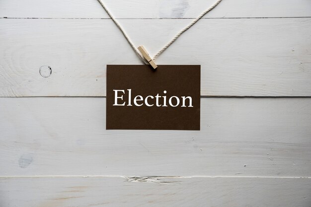 sign attached to a rope with election written on it