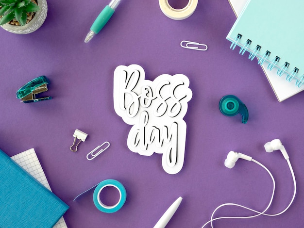 Sign with boss day on desk