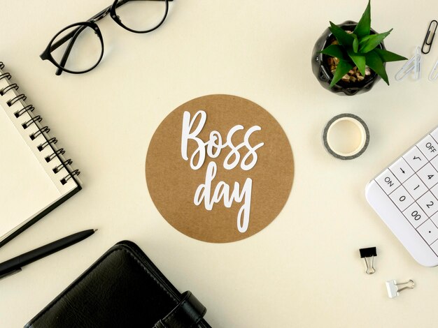 Sign with boss day on desk