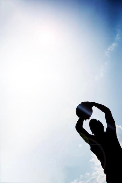 Silhouette basketball player throwing