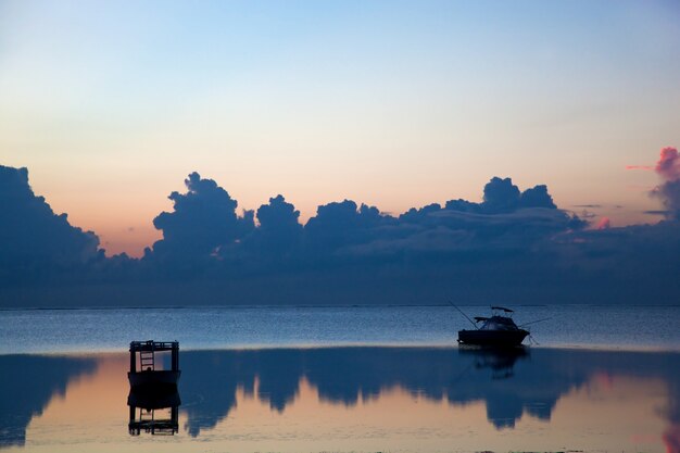 Silhouette of a boat on the beach