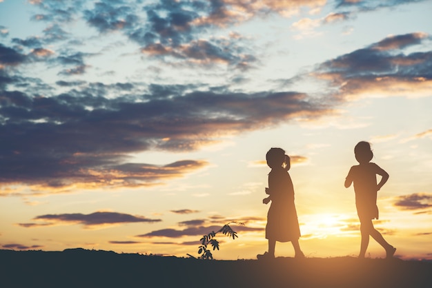 Free photo silhouette of children playing