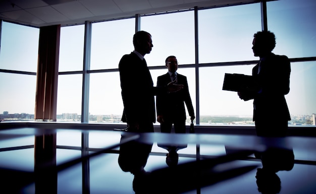 Silhouette of an executive holding a clipboard