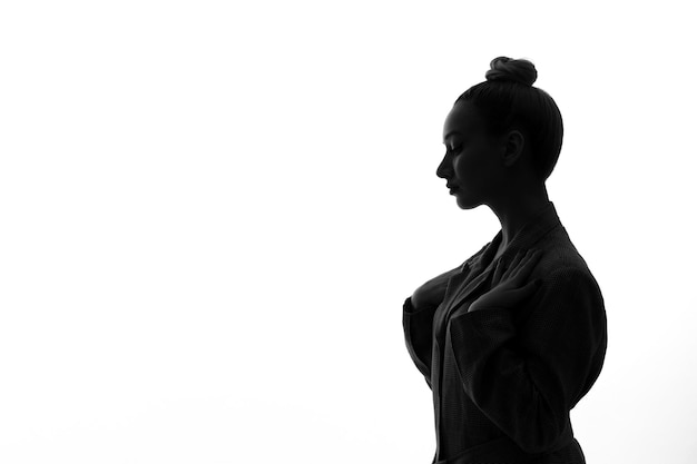 Free photo silhouette of female feeling down side view shadow back lit