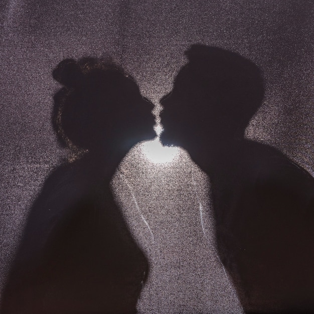 Silhouette of kissing couple