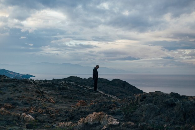 Silhouette of lonely and sad old man