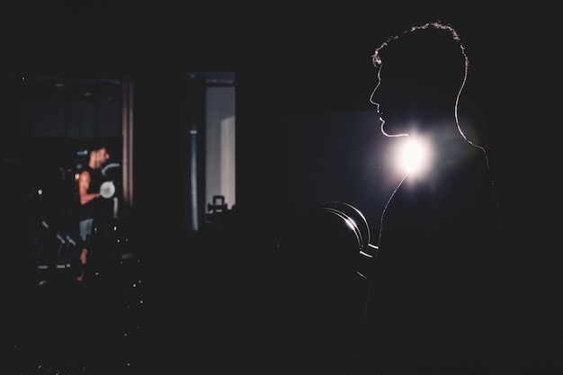 Silhouette of man in gym