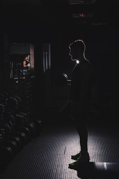 Silhouette of man in gym