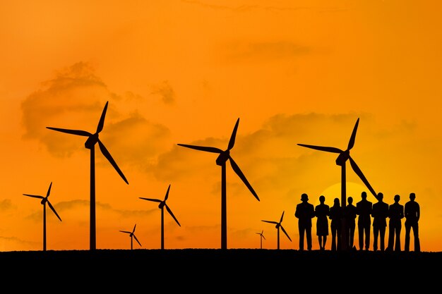 Silhouette of people enjoying the renewable energy