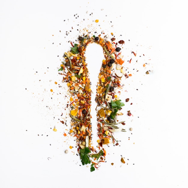 Silhouette of a spoon made of spices