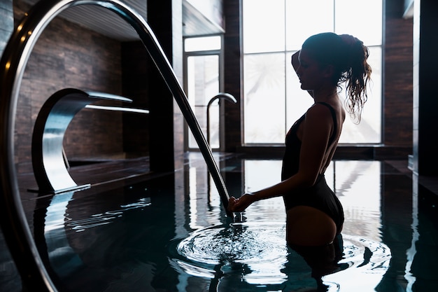 Silhouette of woman in spa