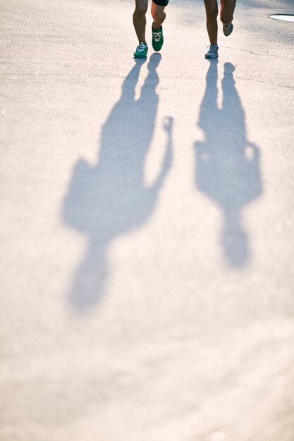 Silhouettes of athletes in the street