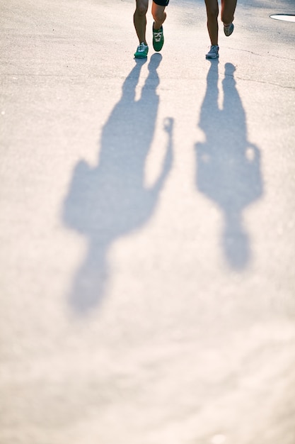 Silhouettes of athletes in the street