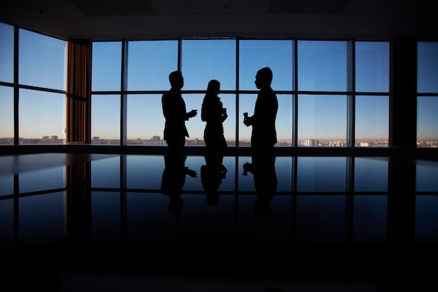 Silhouettes of businesspeople background