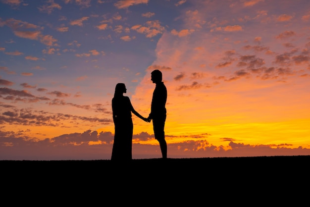 Premium Photo Silhouettes Of Couple Hold Hand Together Romantic Man And Woman Against The Sunset Sky Premium Photo Silhouettes Of Couple Hold Hand Together Romantic Man And Woman Against The Sunset Sky