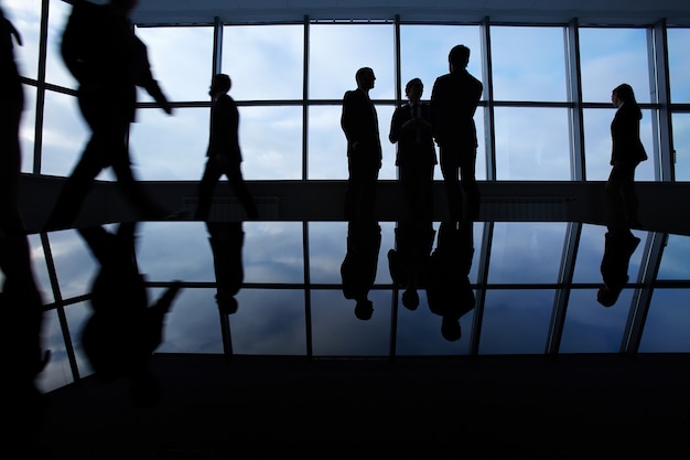 Silhouettes of employees in the office