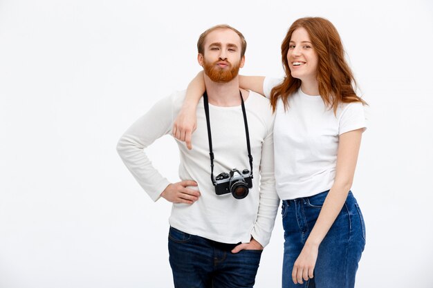 Silly couple taking photo together, smiling