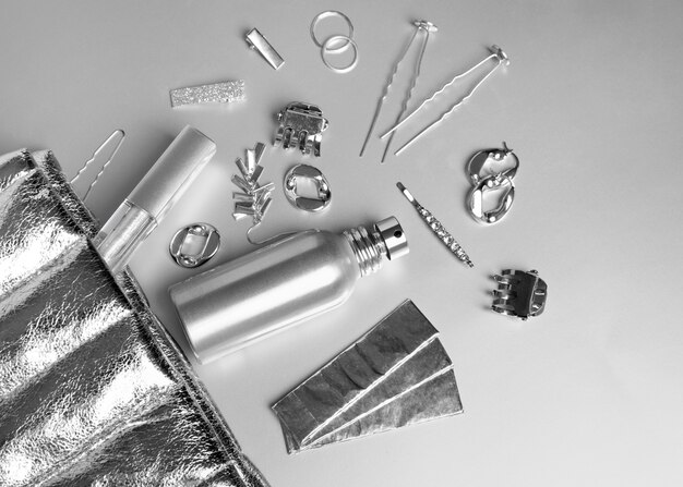 Silver aesthetic wallpaper with accessories top view
