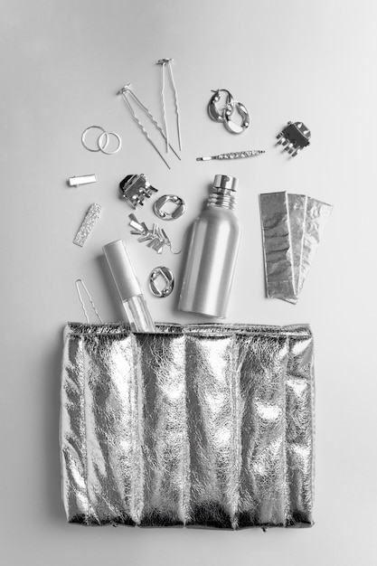 Free photo silver aesthetic wallpaper with accessories