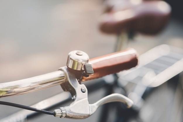 Silver bell on bicycle's handle