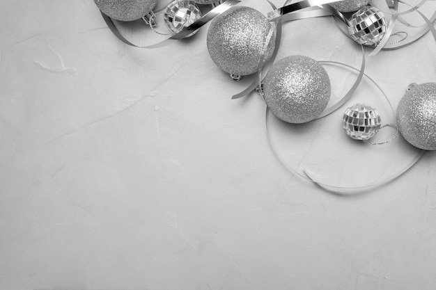 Free photo silver christmas ornaments on white table