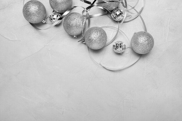 Silver Christmas ornaments on white table